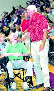 Bobby Knight (right) takes some time prior to his lecture to speak with audience member Harvey Linder. Knight credits Linder with getting him interested in fastpitch softb