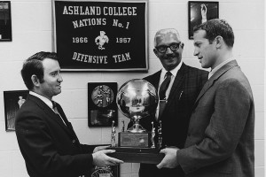 Bill Musselman (right) accepts a trophy during his legendary run as head coach at Ashland College (now known as Ashland University), which saw his teams compile an incredible .845 winning percentage (109-20) from 1965-71. His teams reached the NCAA "College" Tournament four times, highlighted by a 1968-69 squad that allowed an NCAA record-low 33.9 points a game. The 1958 Wooster High graduate had a roller-coaster career that saw him coach 13 teams in 35 years, including the Cleveland Cavaliers, before passing away at age 59 in 2000.